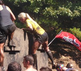 Personal training client conquers the Warrior Dash wall